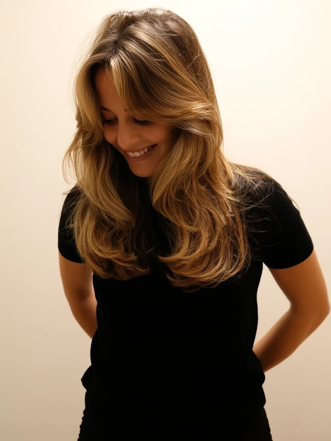 golden honey blonde with soft highlights layered cut